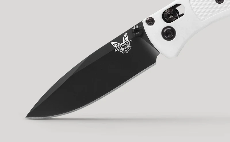 Close view of the Mini Bugout's black drop-point blade and cutting edge