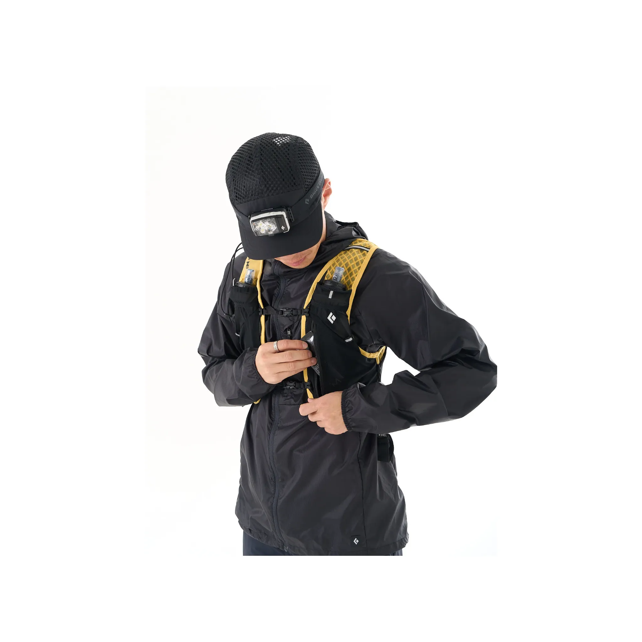 Runner wearing the Black Diamond Distance LT 1100 with a running vest