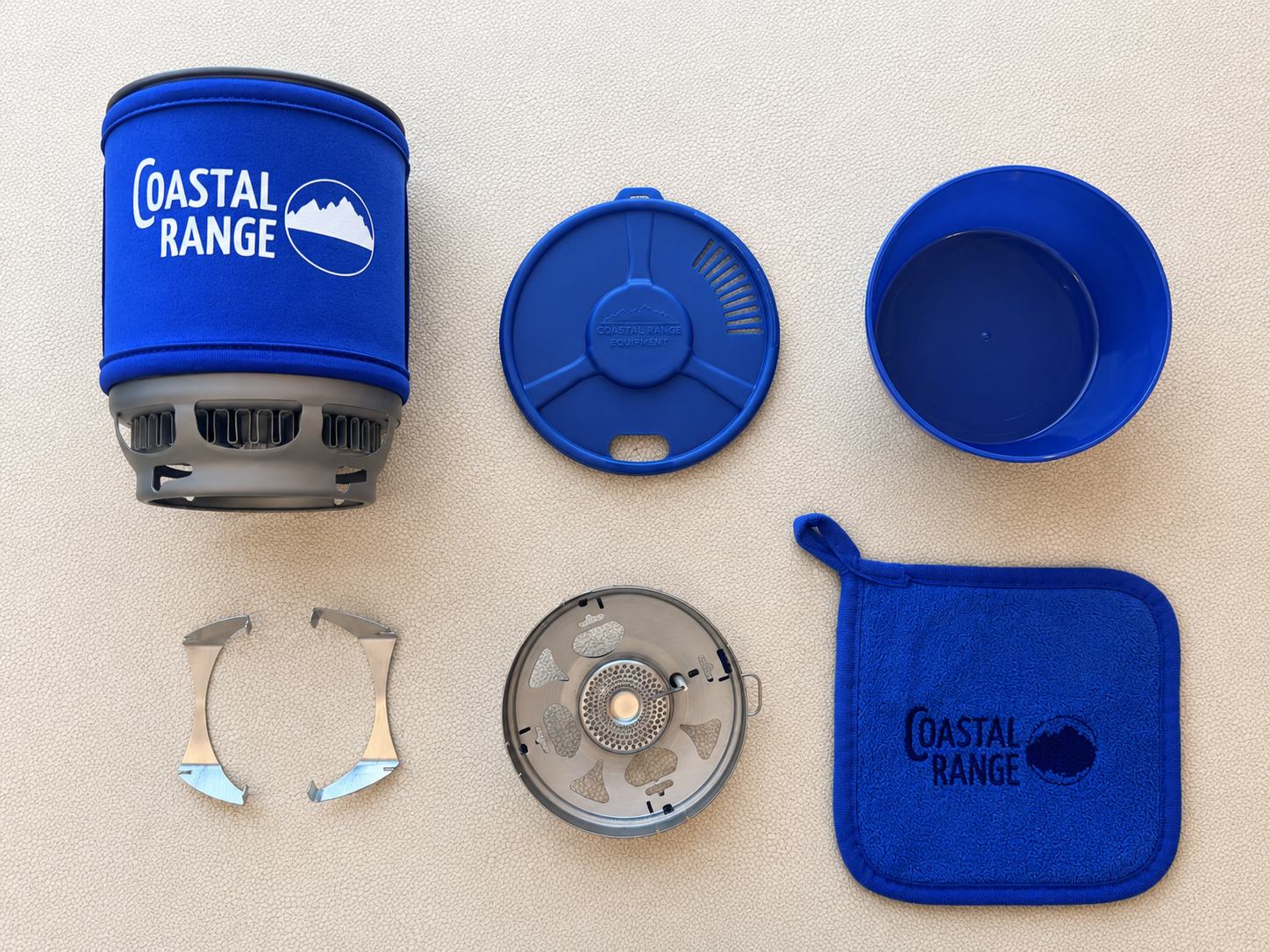 Complete Coastal Range Backpacker stove kit laid out with pot, burner, bowl and accessories