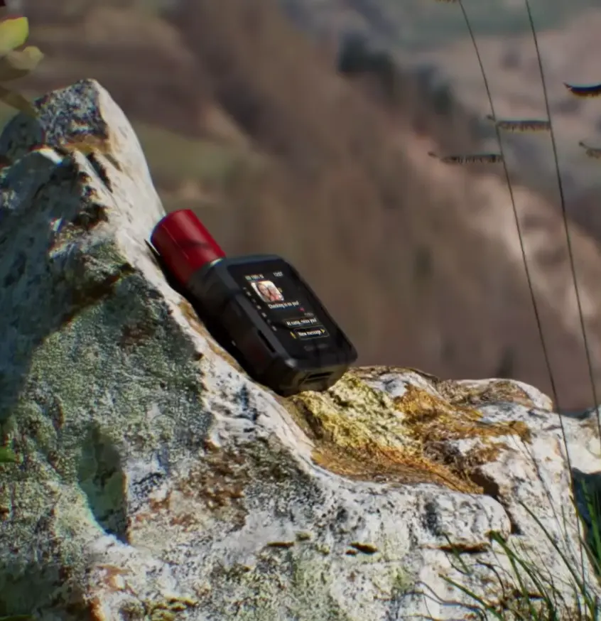Garmin inReach Mini 3 Plus resting on a rock outdoors