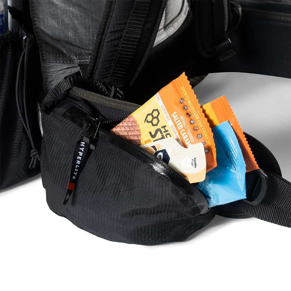 Snacks stored inside the hipbelt pocket of a Hyperlite Mountain Gear Unbound 40