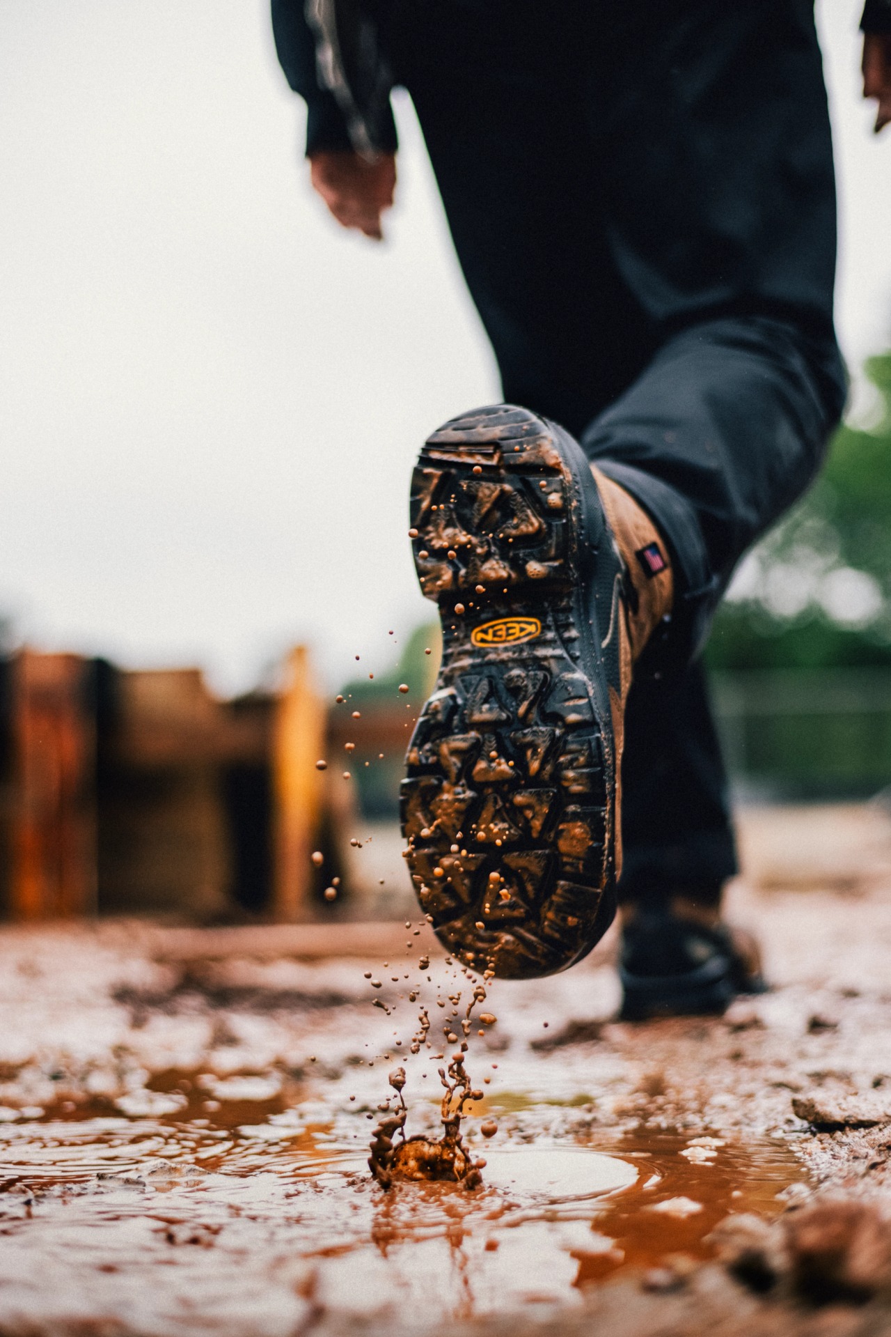 Mud falling from the tread of a KEEN Targhee IV Work boot