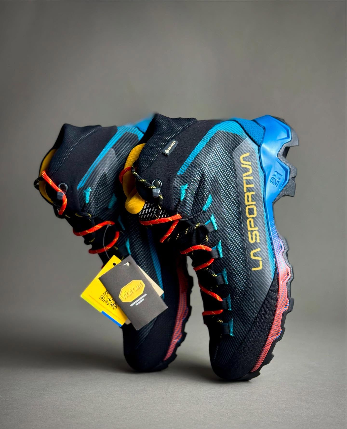 Two La Sportiva Aequilibrium Hike GTX boots with their uppers and lacing visible