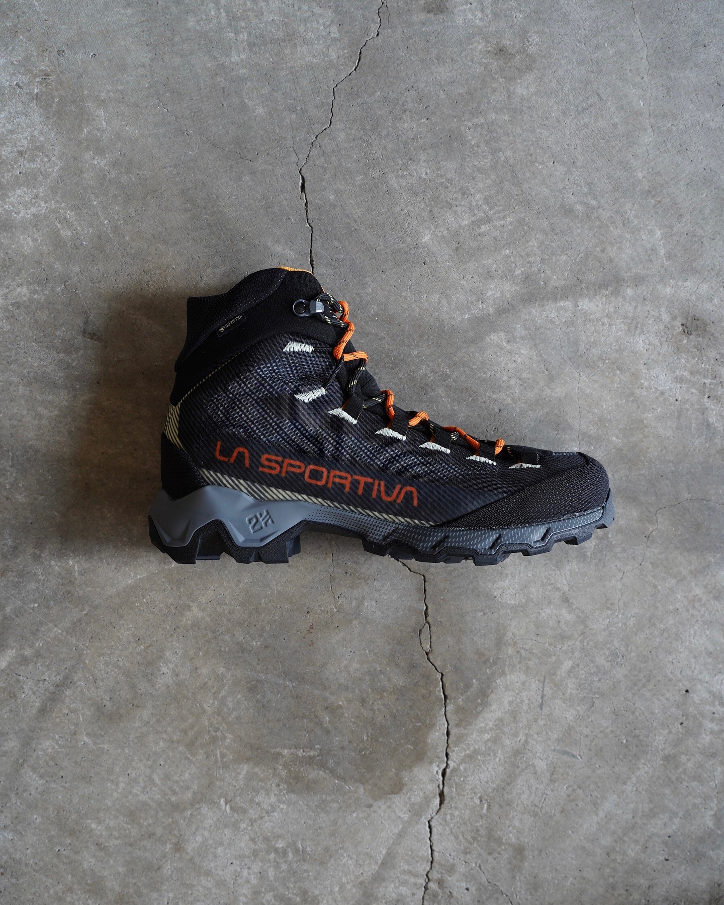 Side profile of an Aequilibrium Hike GTX boot showing the upper and heel
