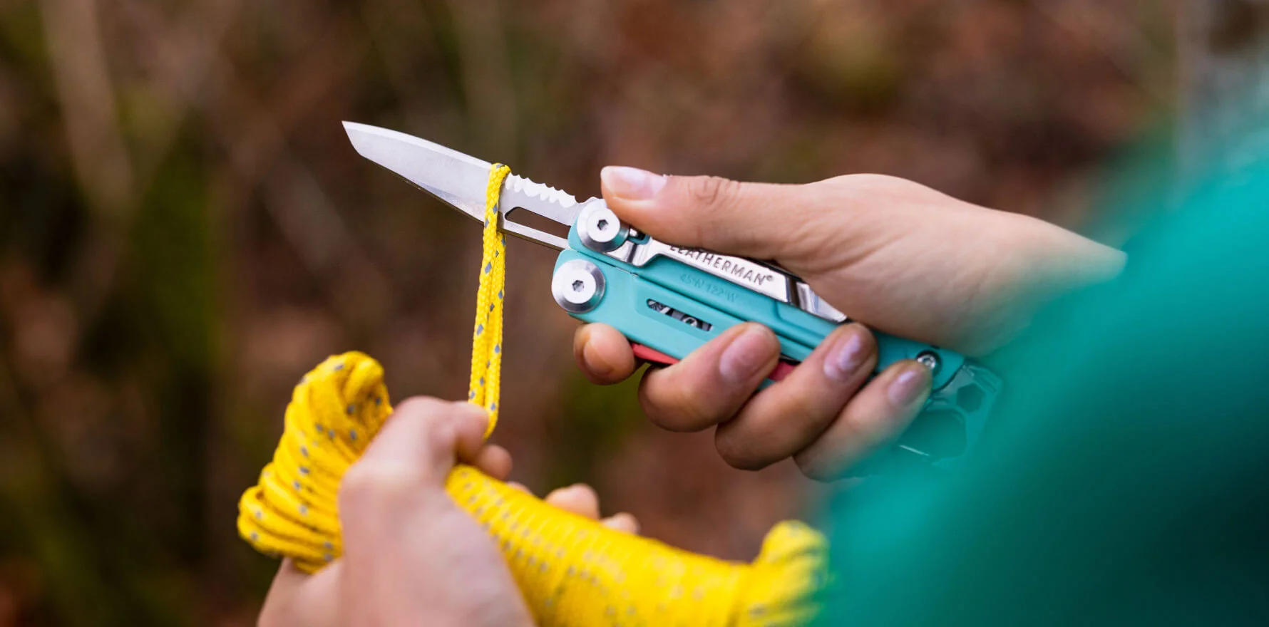 Leatherman Signal combo blade cutting yellow cord