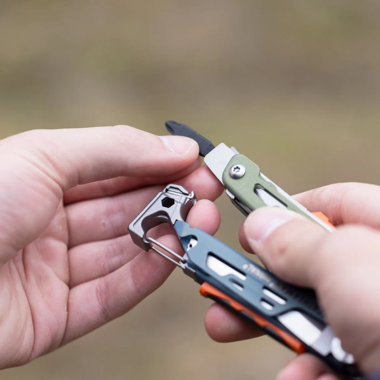 Small removable ferrocerium rod being inserted into a Leatherman Signal handle