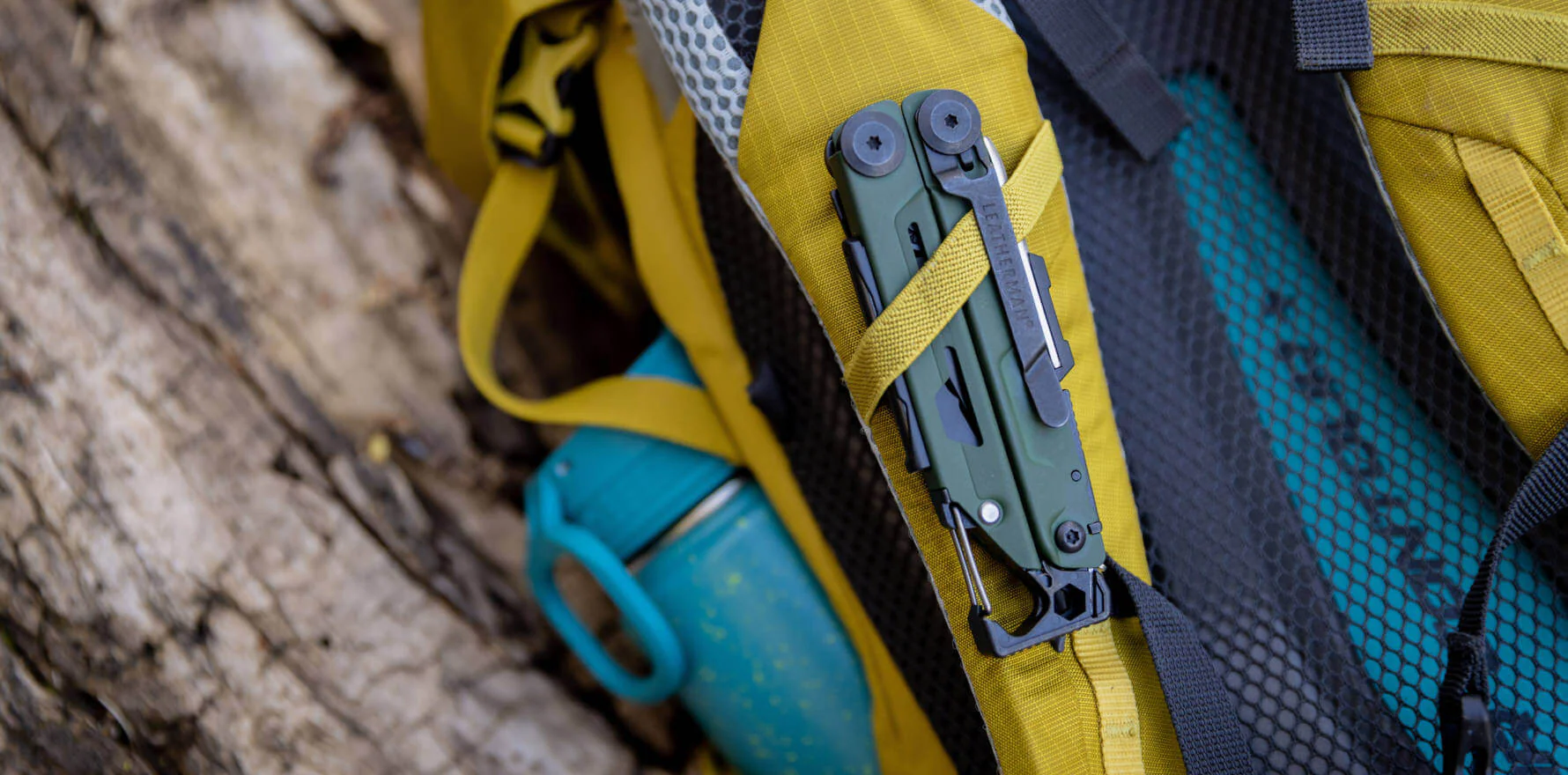 Leatherman Signal clipped vertically to a backpack shoulder strap