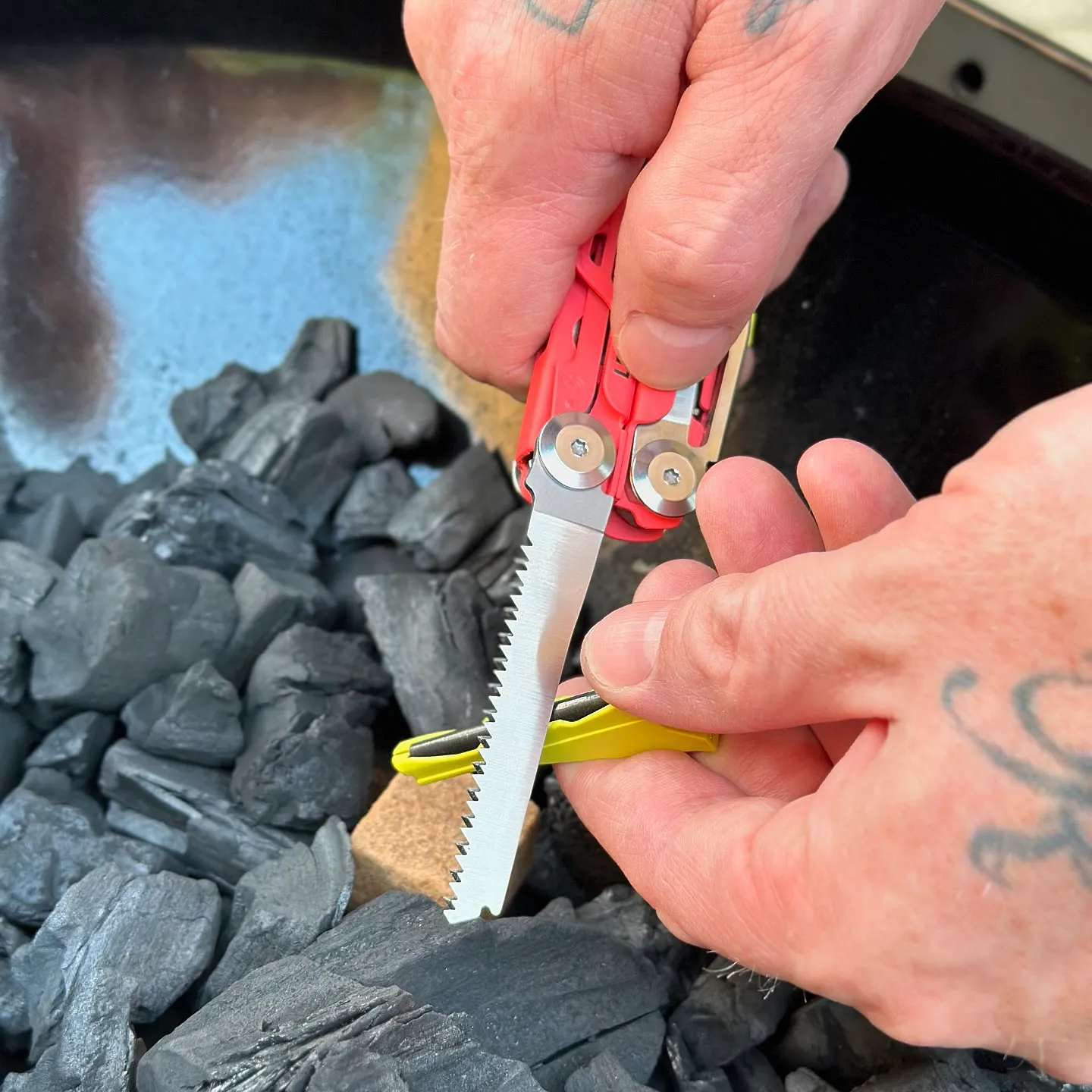 Leatherman Signal saw extended during camp use