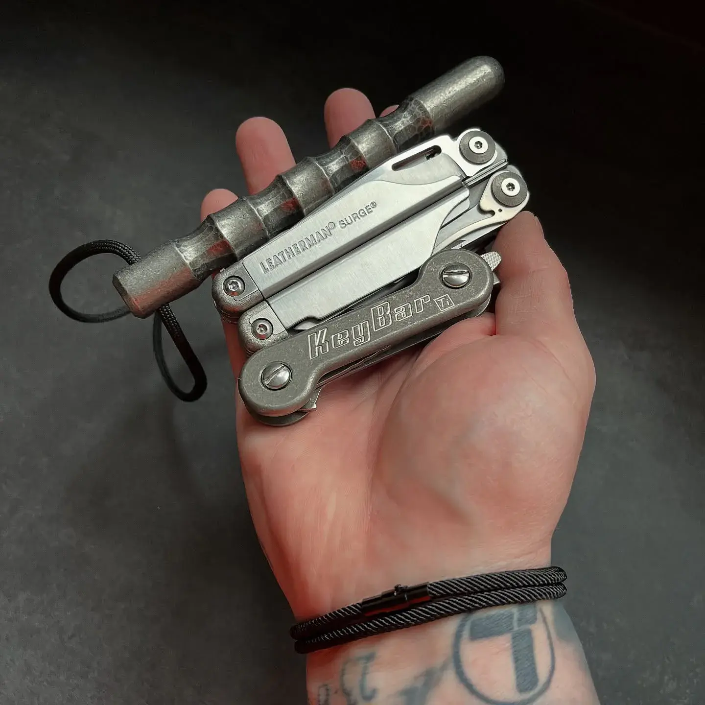 Closed Leatherman Surge resting in a person's hand for scale