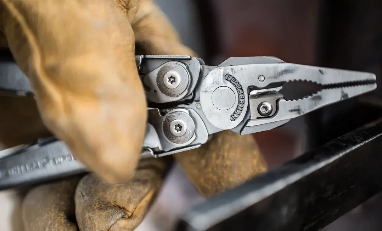 Leatherman Surge pliers held in work gloves