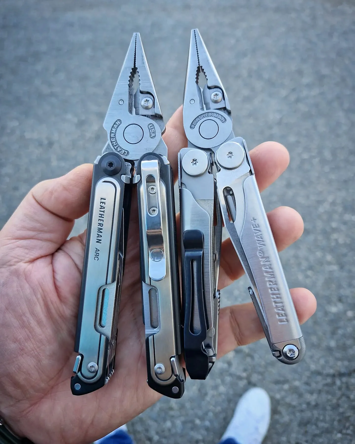 Leatherman ARC and Wave+ held side by side with their pliers open