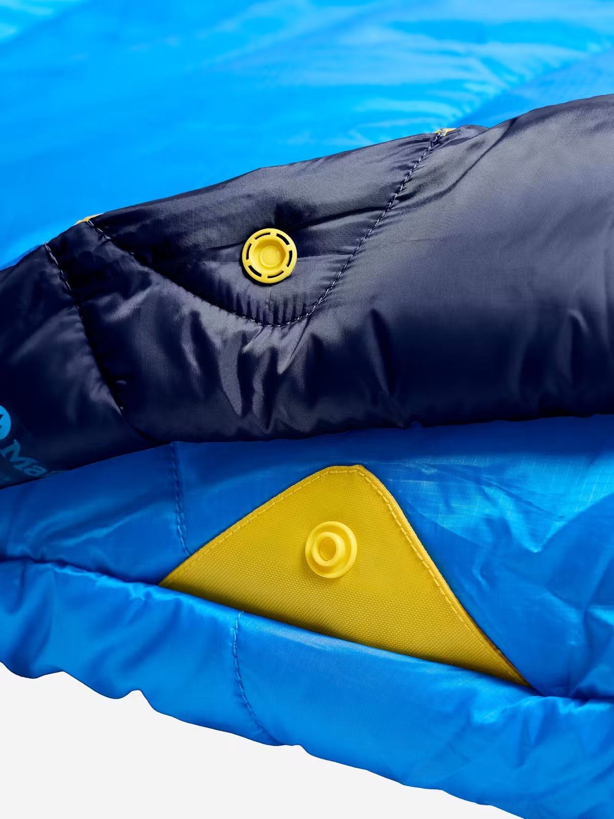 Close view of a Marmot Wraptor 30 snap and reinforced fabric