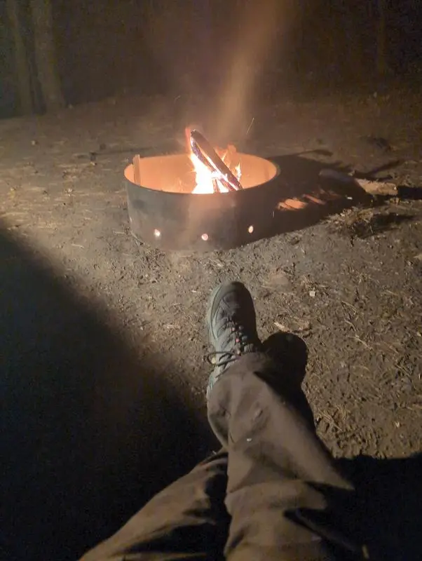Merrell Moab 3 Mid Waterproof boot beside a campfire after a day outdoors