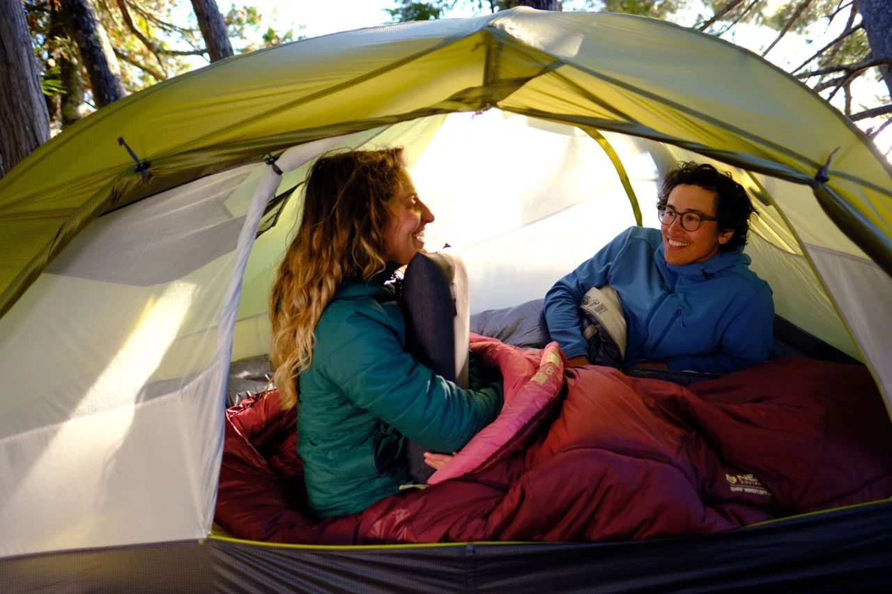 Campers using NEMO sleeping mats inside a tent
