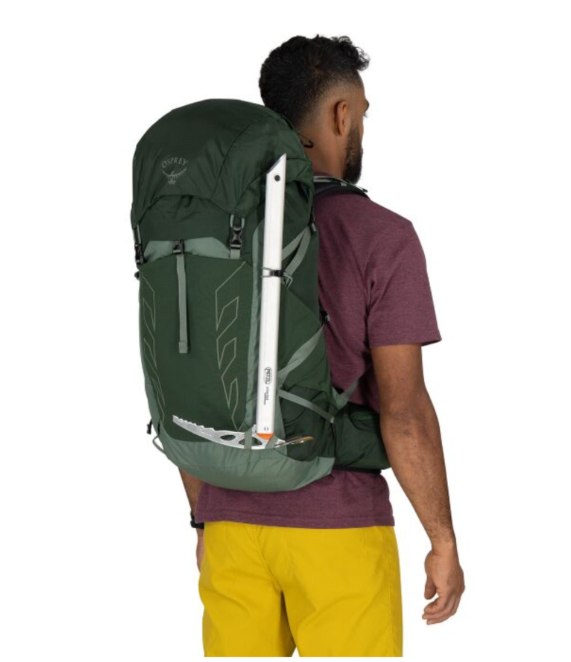 Green Osprey Talon 33 worn on a hiker's back