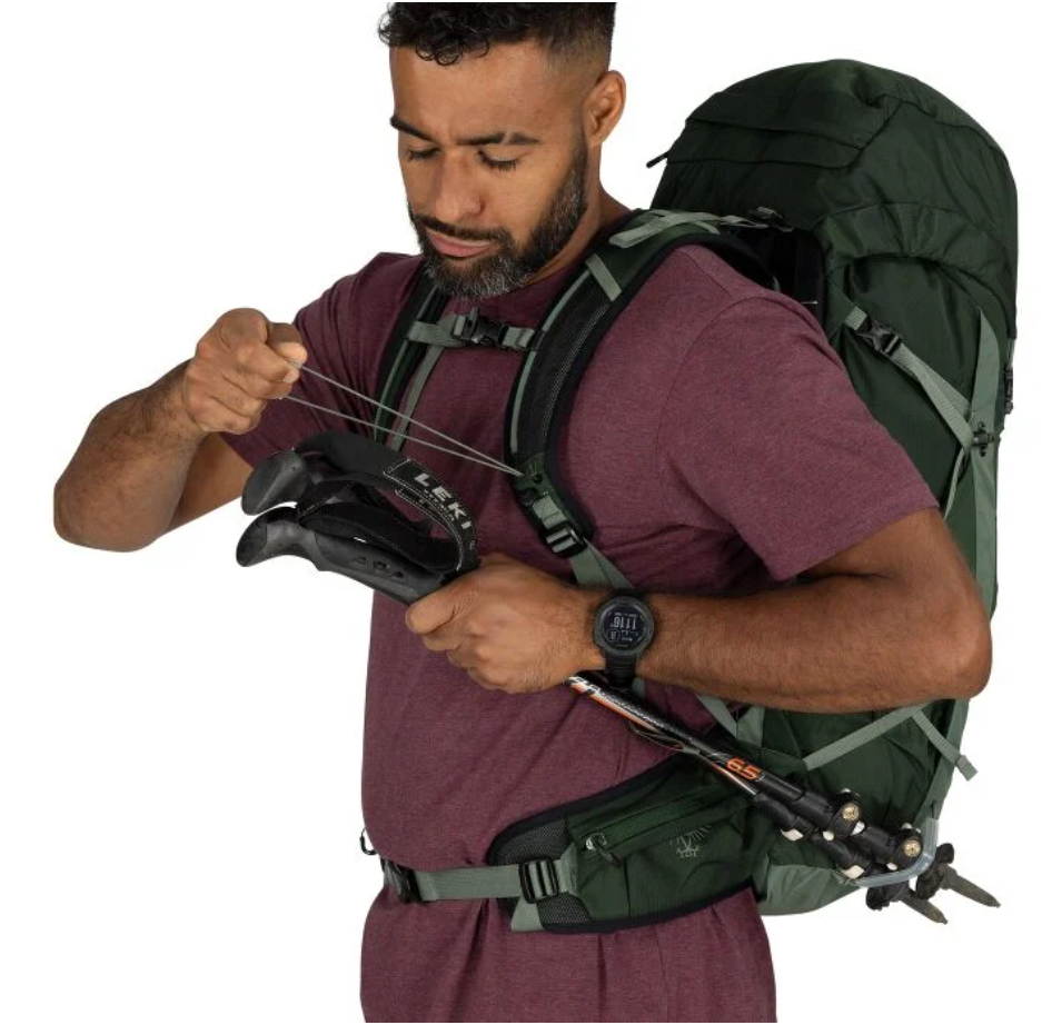Talon 33 trekking pole attachment shown on a hiker