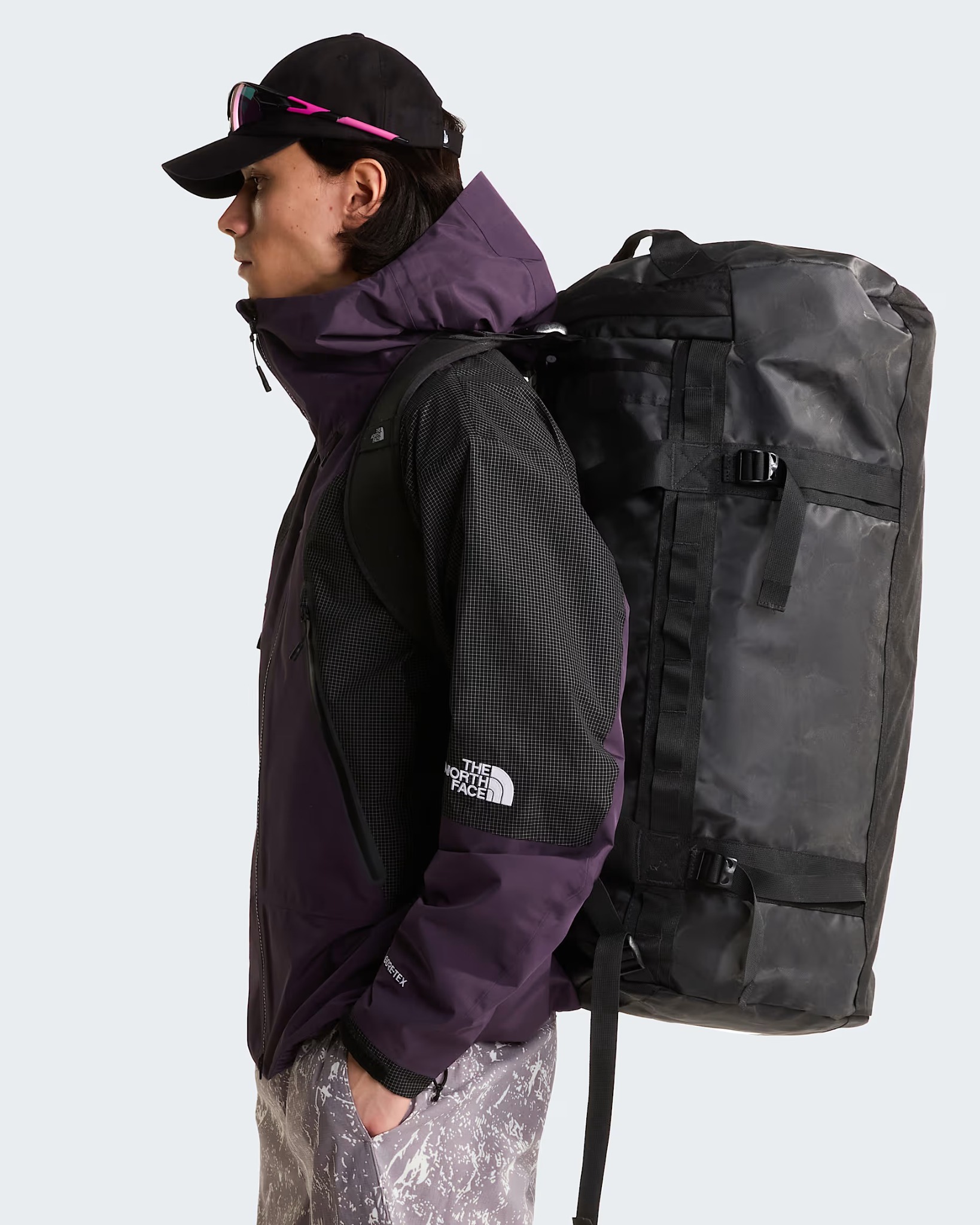 The North Face Base Camp Duffel 95L worn using its shoulder straps