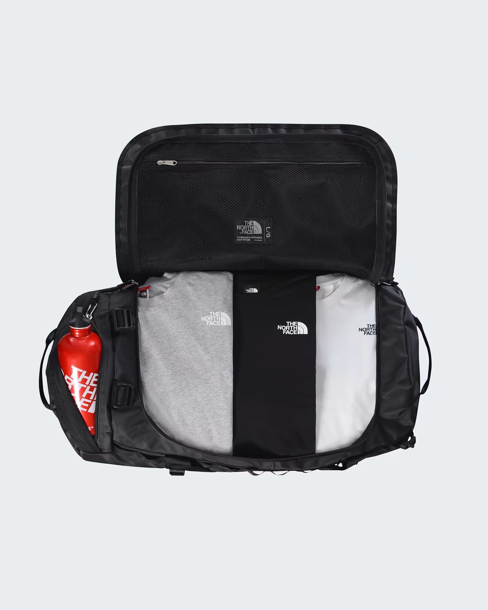 Open Base Camp Duffel 95L showing its main compartment and mesh lid pocket