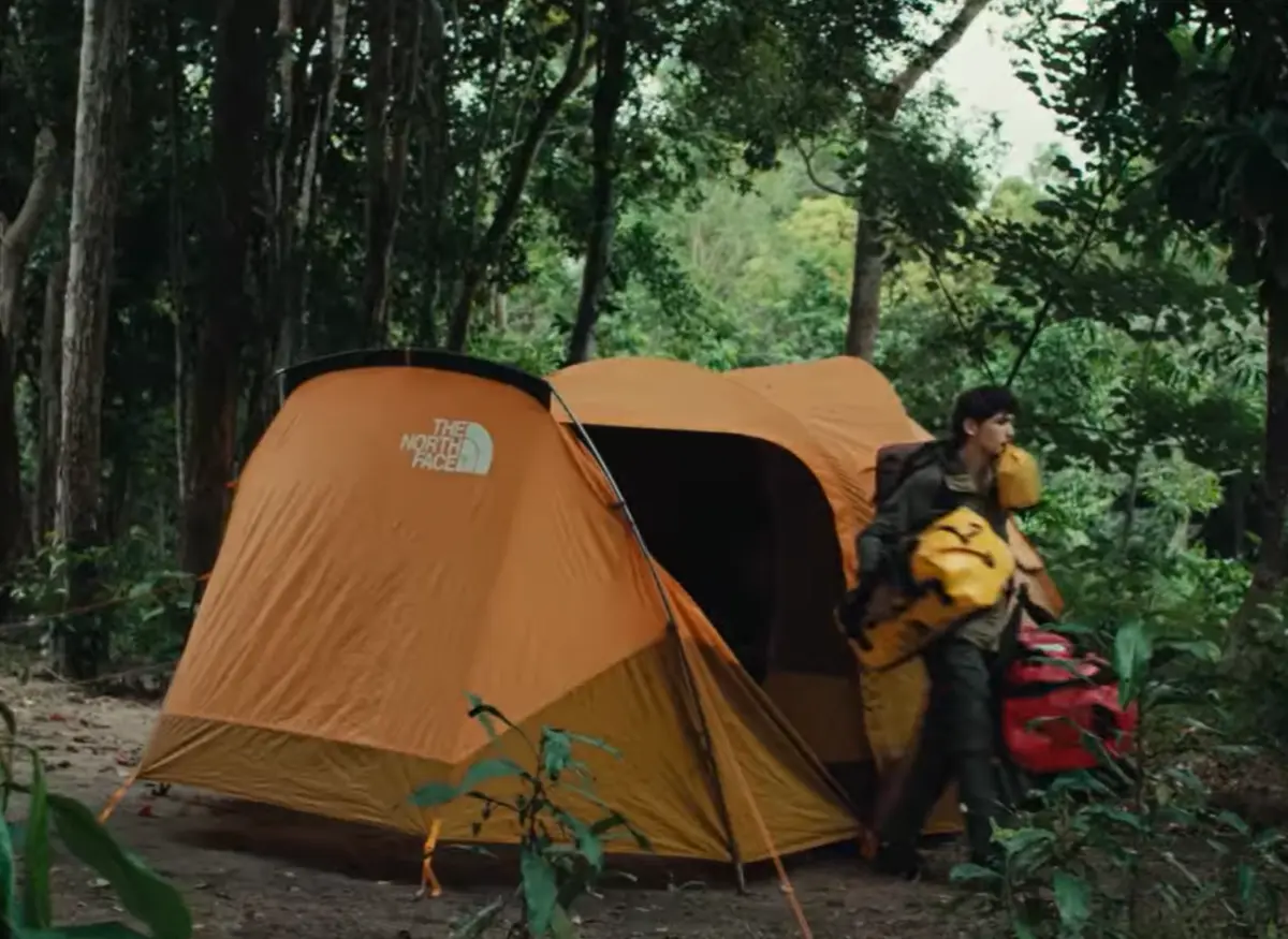 Orange The North Face Wawona 6 pitched at a wooded campsite