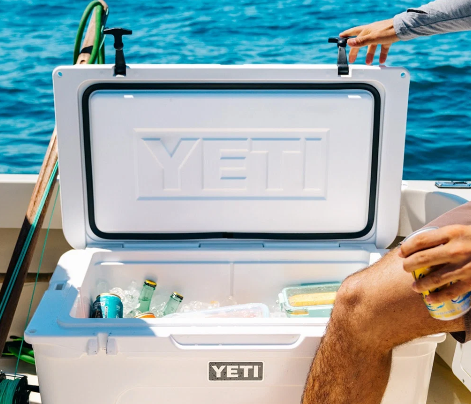 Open white YETI Tundra 65 on a boat with food and drinks inside