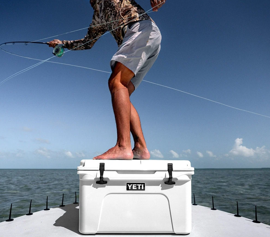 Angler standing on a white YETI Tundra 65 on a boat