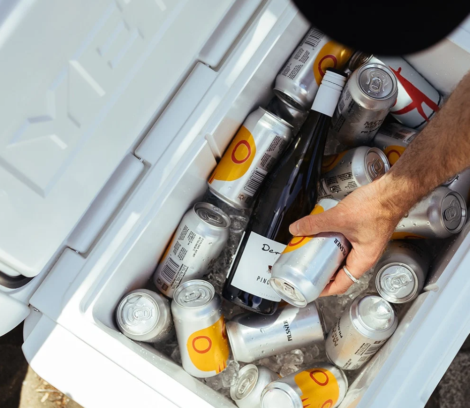 Top view of a white YETI Tundra 65 packed with cans and bottles